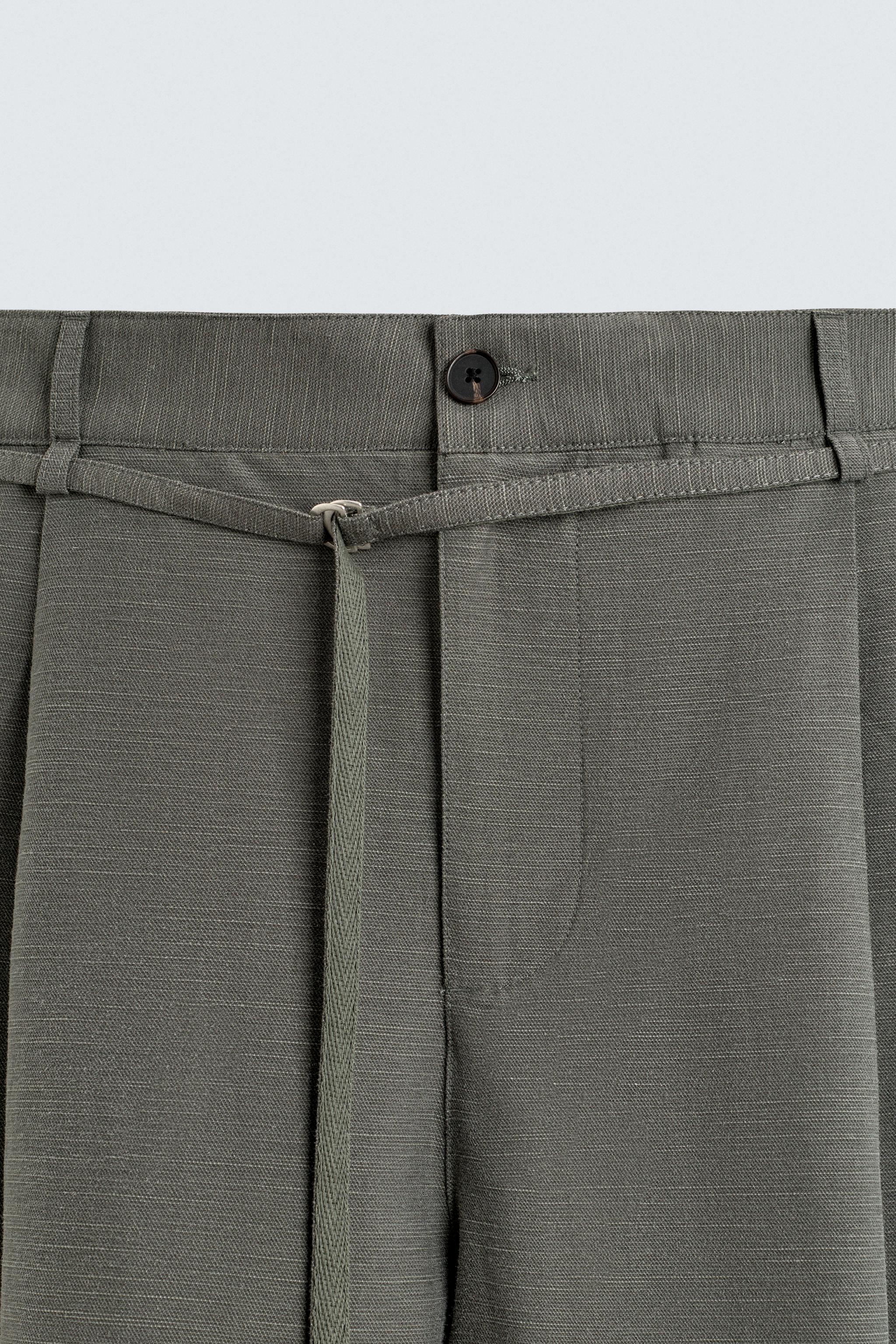 BALLOON FIT PLEATED BELTED PANTS